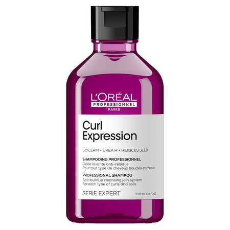 Fioletowa butelka szamponu L’Oréal Curl Expression na białym tle.